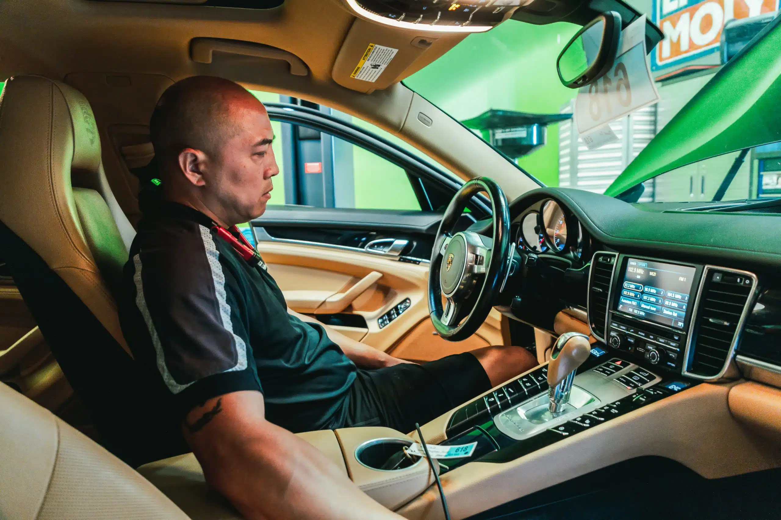 Duke sitting in a Porsche Panamera at Bavarian Rennsport in Jacksonville, FL